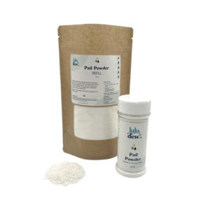 a bag of Luludew Pail Powder refill and a shaker bottle of luludew pail powder with a small amount of powder on the side