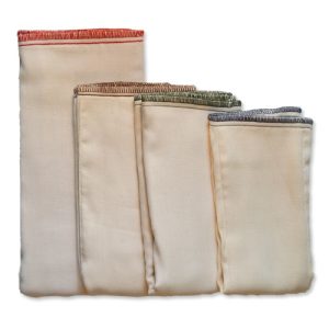 four prefold diapers folded lying largest to smallest